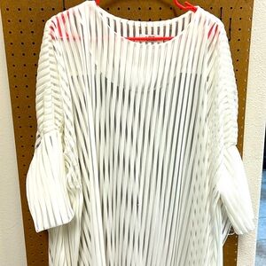 White transparent blouse. Short from front and talk from back